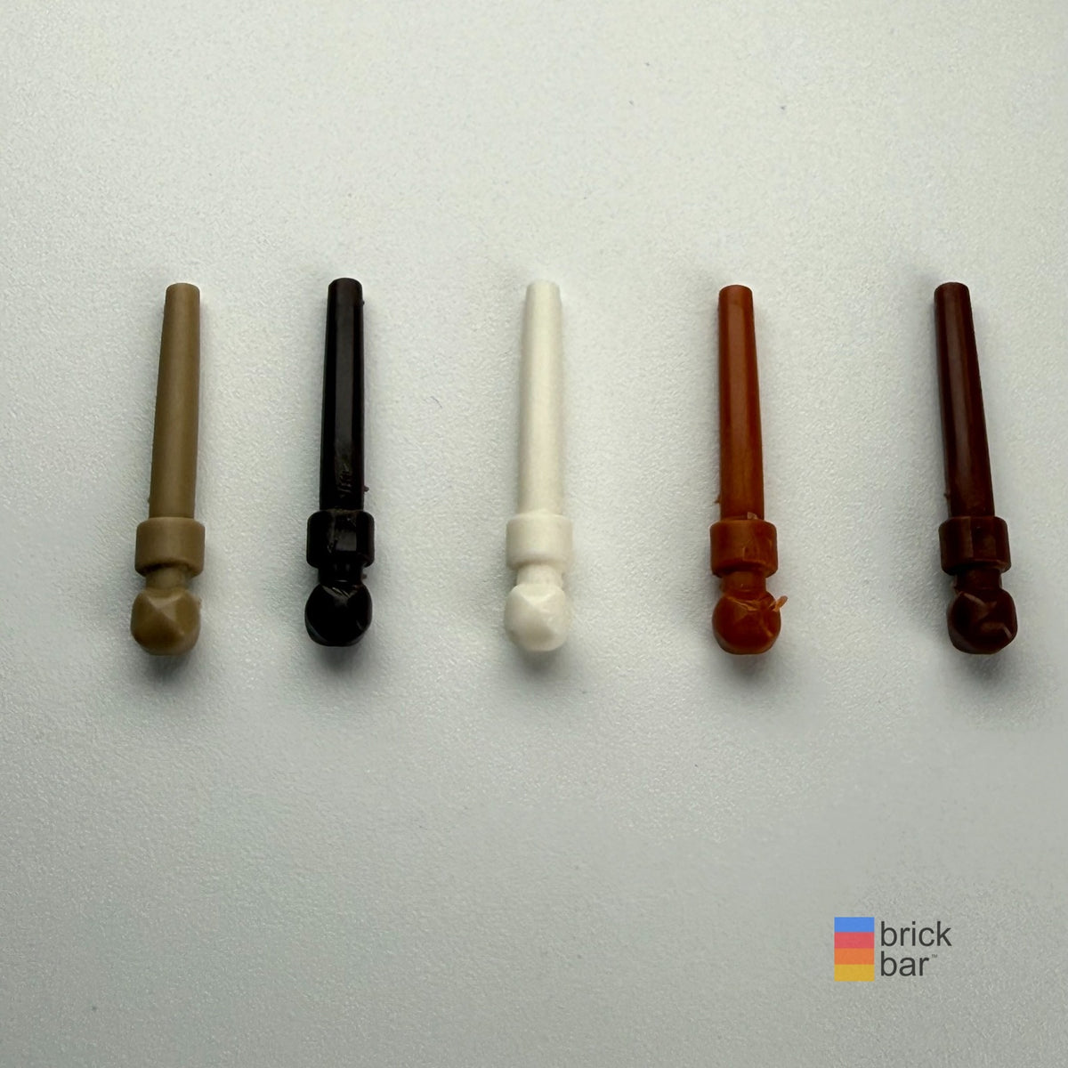 LEGO Harry Potter wands 36752a, left to right: Dark Tan, Black, White, Dark Orange, Reddish Brown. Sold individually by selected color.