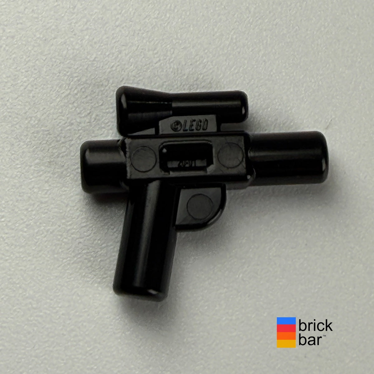 Black Star Wars small blaster 92738 with scope, side view photographed by Brick Bar.