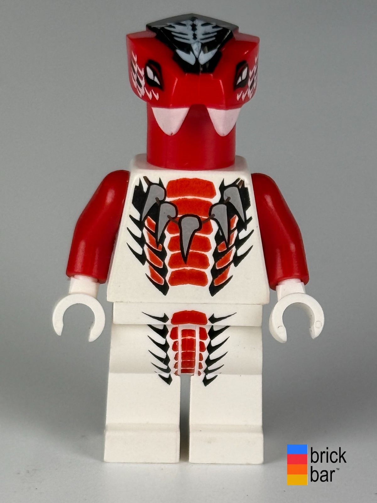 Fang-Suei njo0036, front view: red snake headpiece, printed white torso and legs with red and black scale details.