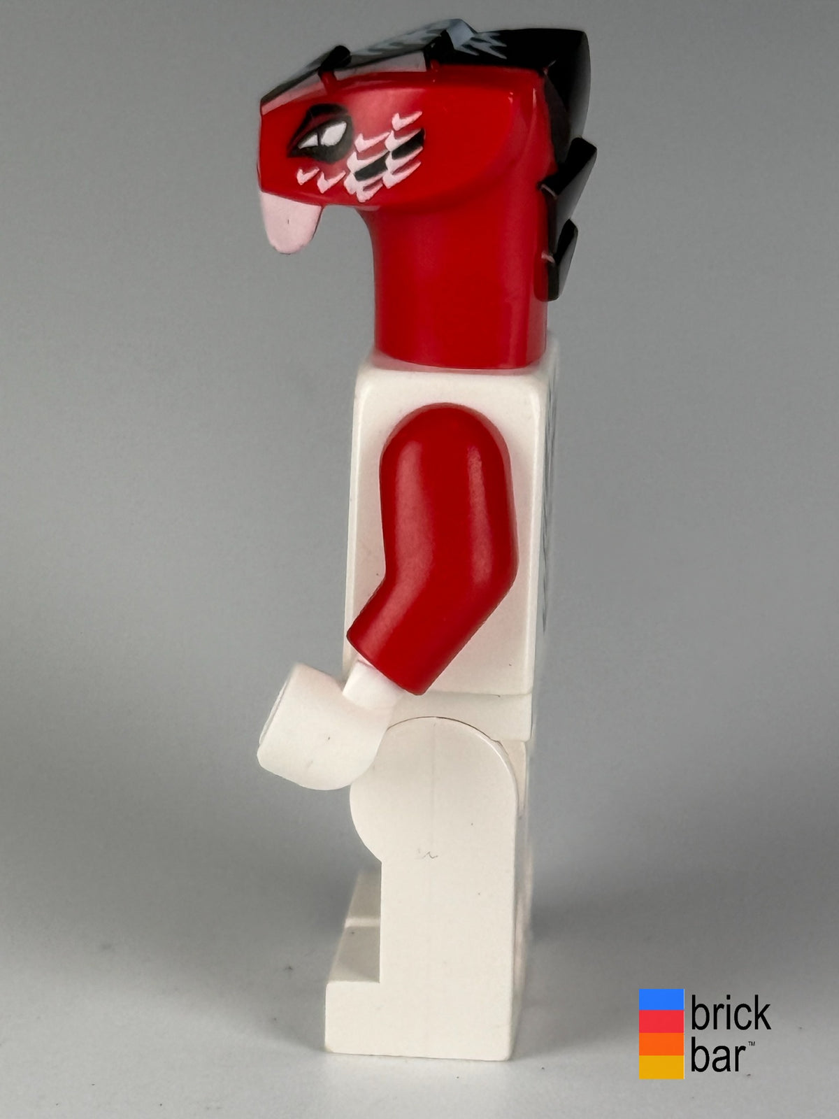 Fang-Suei njo0036, side view showing the red snake headpiece and figure profile.