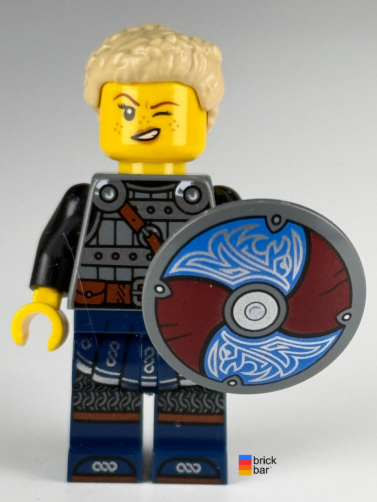 LEGO Viking Shield-Maiden idea170 with tan braided ponytail and raven-pattern shield — alternate-face view