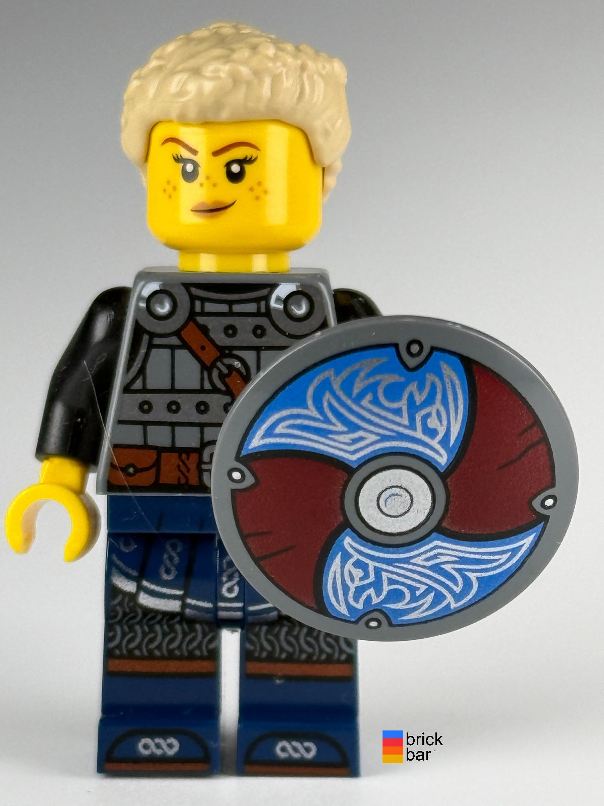 LEGO Viking Shield-Maiden idea170 with tan braided ponytail and raven-pattern shield — front view