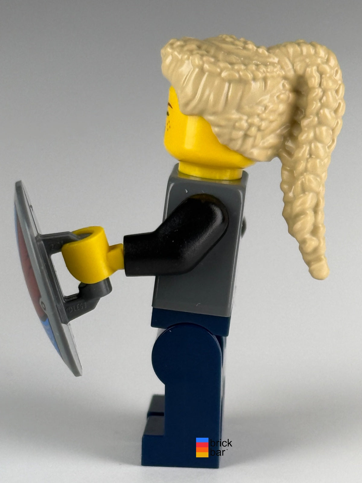 LEGO Viking Shield-Maiden idea170 with tan braided ponytail and raven-pattern shield — side view