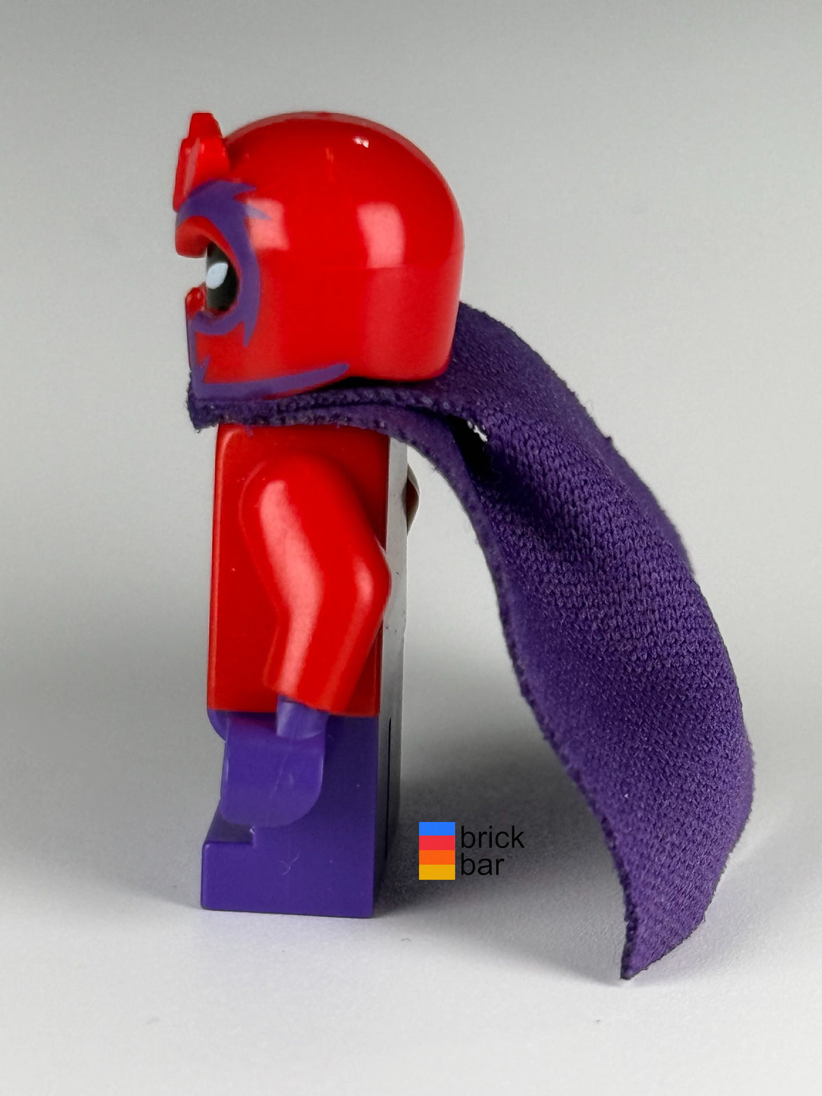 Side view of Magneto - Short Legs LEGO minifigure sh0365 showing helmet profile and purple cape