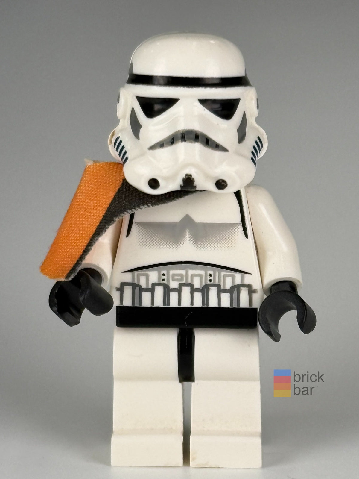 Front view of Sandtrooper sw0109a with solid-mouth helmet and orange shoulder pauldron