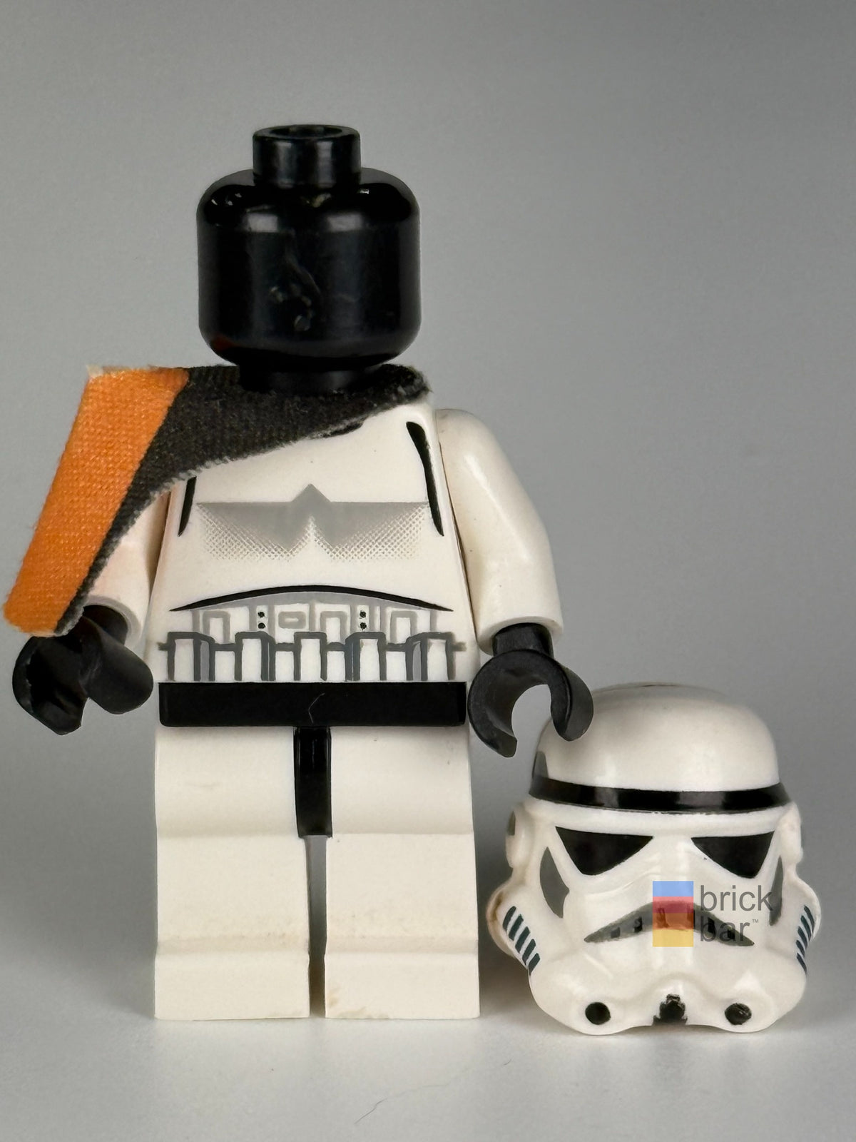 Helmet-off view of Sandtrooper sw0109a revealing plain black head and original solid-mouth helmet