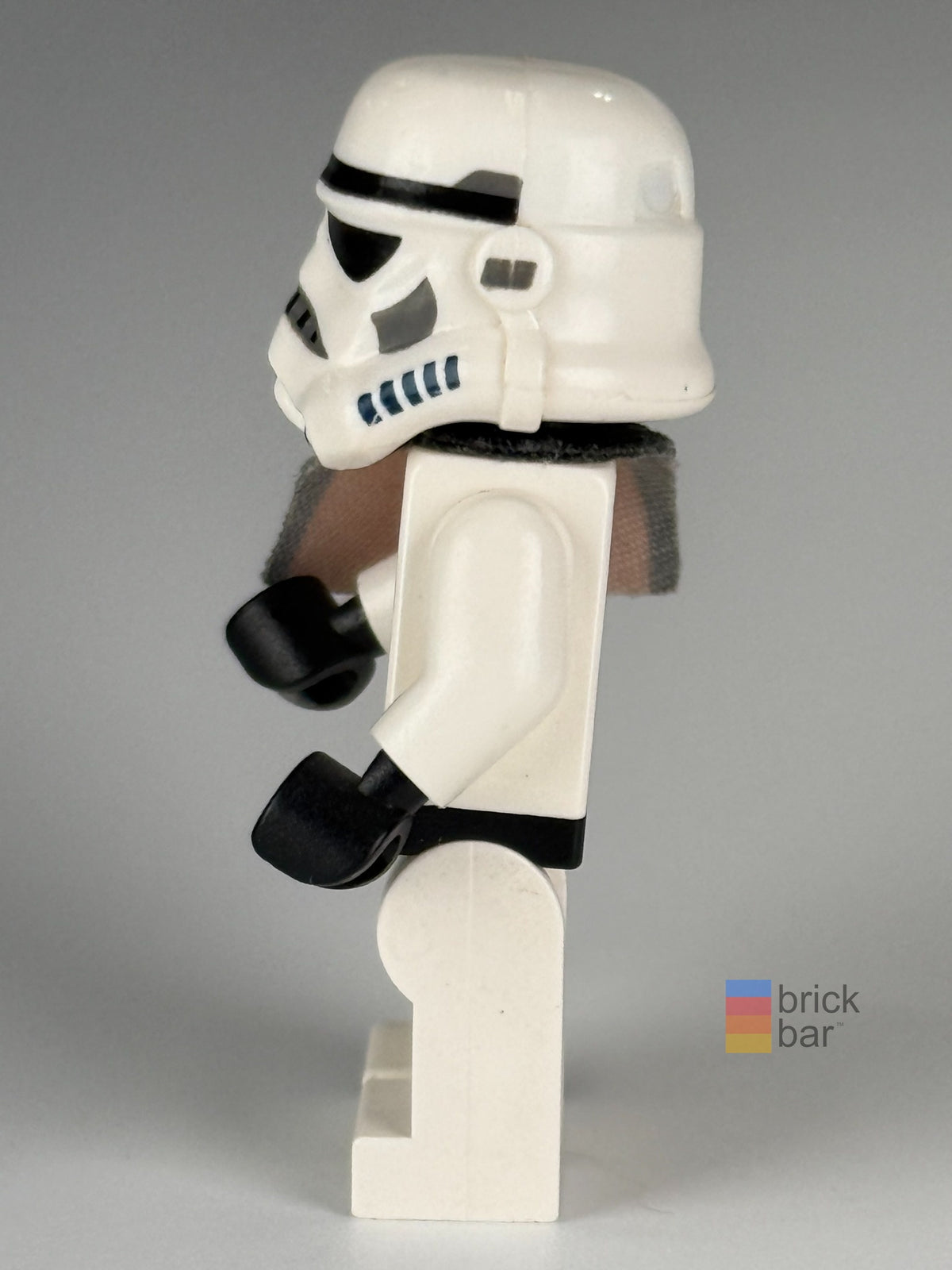 Side view of Sandtrooper sw0109a showing helmet, white armor, and original orange fabric pauldron