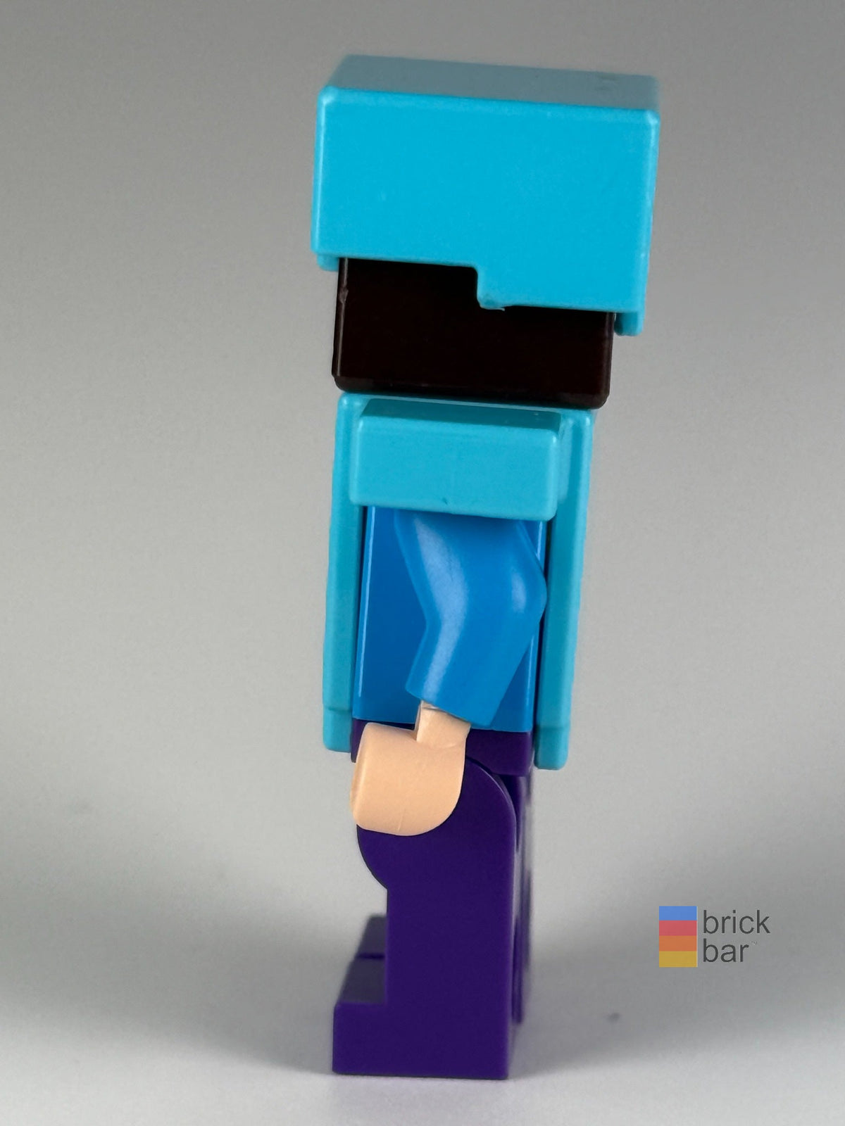 Steve - Dark Purple Legs, Medium Azure Helmet and Armor min020 LEGO® Minecraft Minifigure side view — Brick Bar