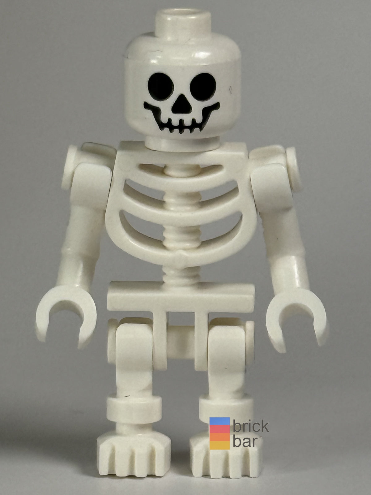 Brick Bar original photograph of Skeleton - Standard Skull, Bent Arms Vertical Grip gen047, front view