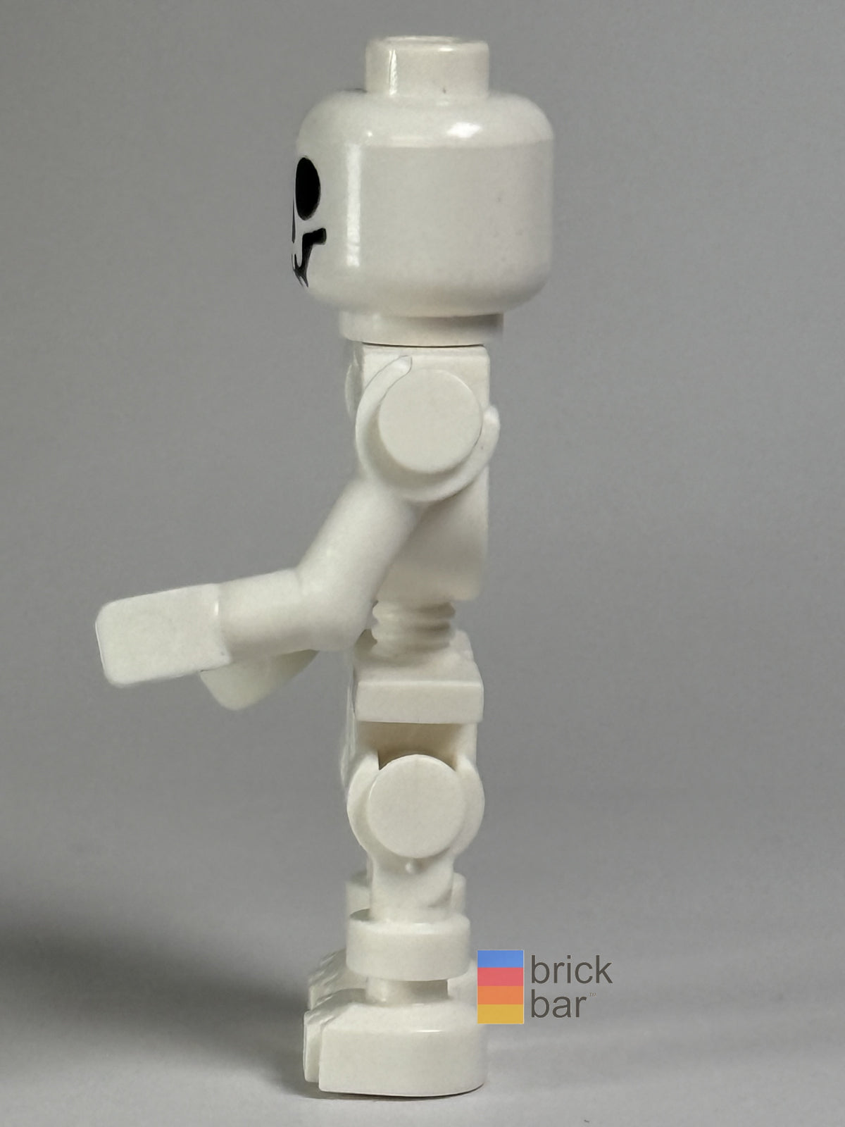 Brick Bar original photograph of Skeleton - Standard Skull, Bent Arms Vertical Grip gen047, side view