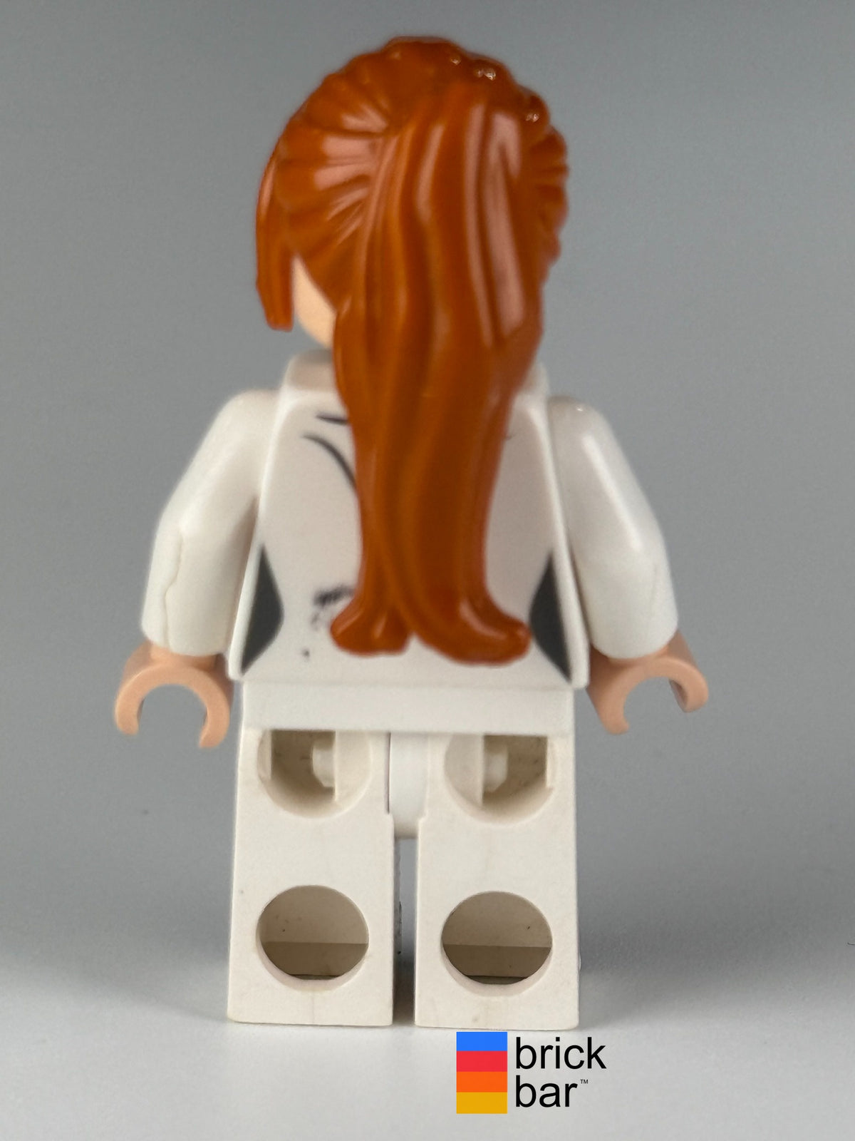 Side view of LEGO Marvel Super Heroes Pepper Potts in white suit, minifigure sh0068.