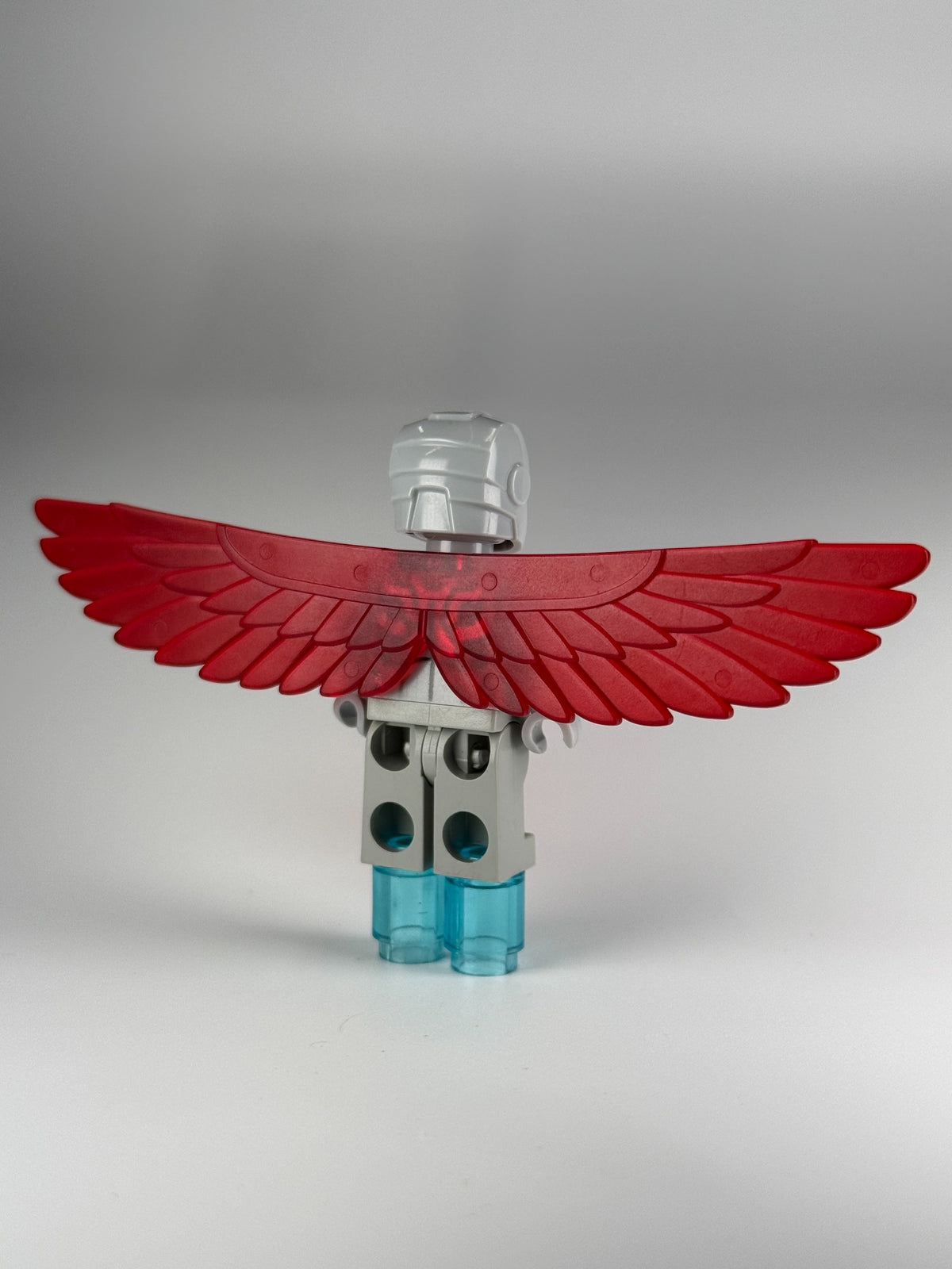 Super-Adaptoid sh0366 back view with red wings and translucent light-blue foot repulsors